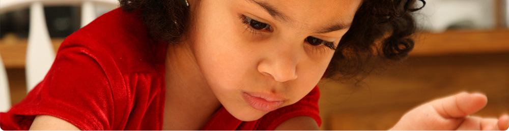 A young child coloring.